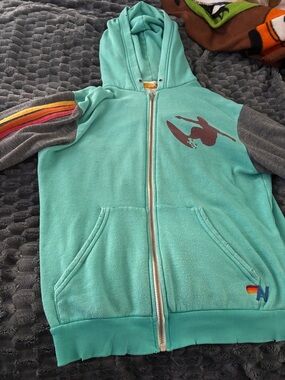 Aviator Nation Aqua Zip-Up Hoodie with Gray Sleeves and Rainbow Stripes